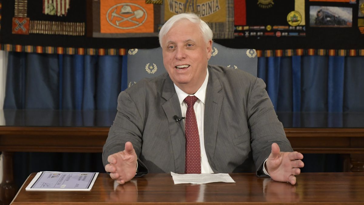Governor Jim Justice at Desk to Award Kanawha County BRIDGE Grants